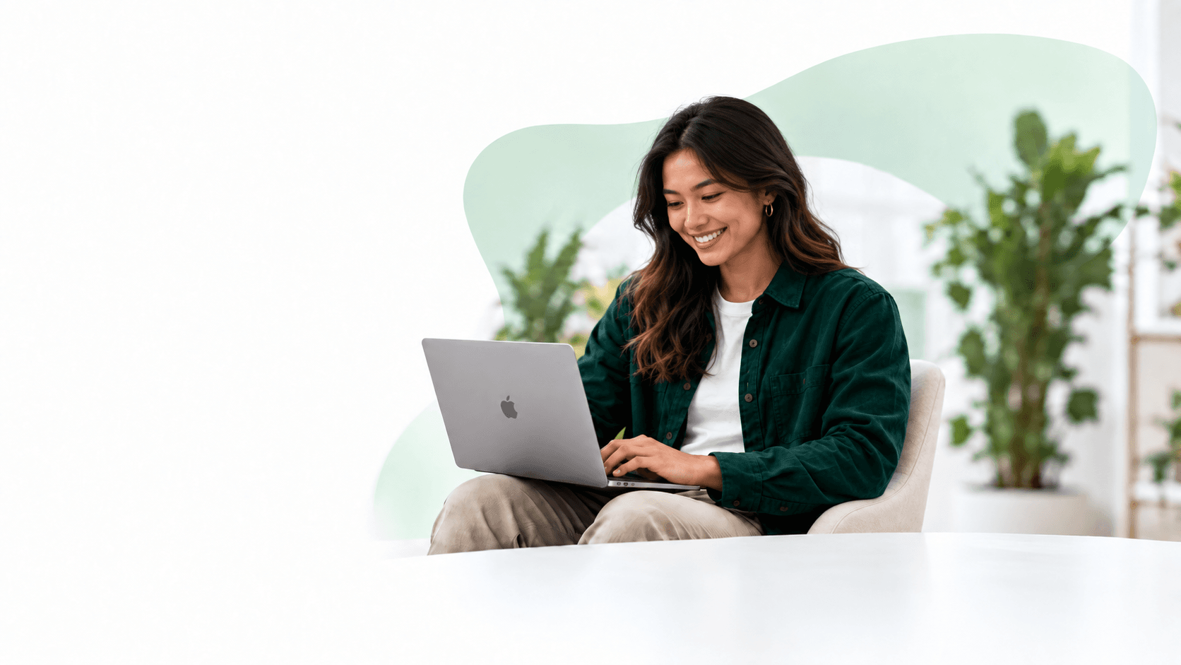 Professional using Dart Smart Payroll on a laptop in a modern workspace